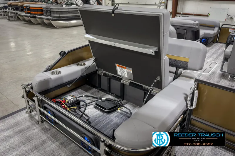 Slide: The Image of 2025 Bennington 22 MSB pontoon boat interior with seating and storage compartments. - 22