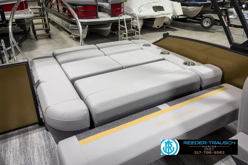 Slide: The Image of 2025 Bennington 22 MSB pontoon boat interior with plush seating and cup holders. - 25