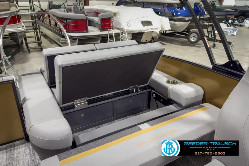 Slide: The Image of 2025 Bennington 22 MSB boat interior with open storage compartment. - 27