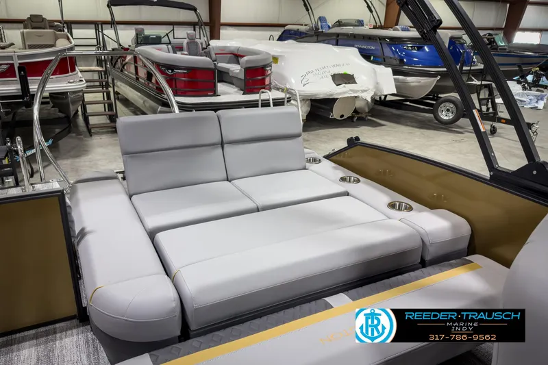 Slide: The Image of 2025 Bennington 22 MSB pontoon boat with luxurious seating in showroom. - 28