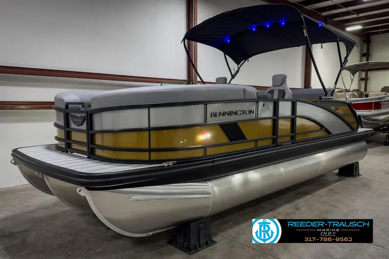 Slide: The Image of 2025 Bennington 22 MSB pontoon boat with canopy in showroom. - 3