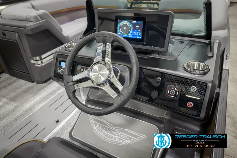 Slide: The Image of Interior of 2025 Bennington 22 MSB boat with modern steering and dashboard controls. - 31