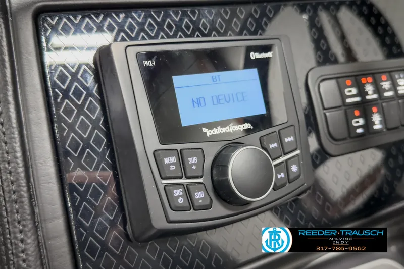 Slide: The Image of 2025 Bennington 22 MSB boat dashboard with Rockford Fosgate Bluetooth stereo system. - 32