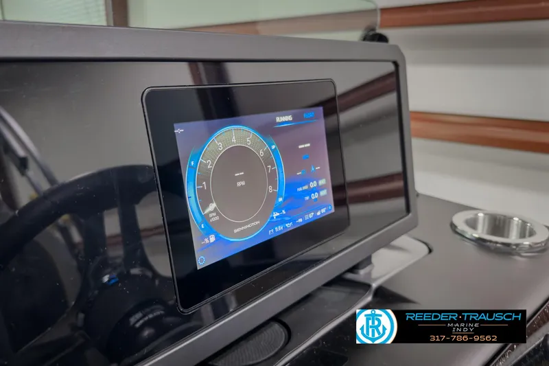 Slide: The Image of Bennington 22 MSB 2025 dashboard with digital display and controls. - 34