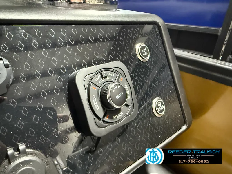Slide: The Image of Control panel of 2025 Bennington 22 MSB boat with Reeder-Trausch Marine branding. - 36
