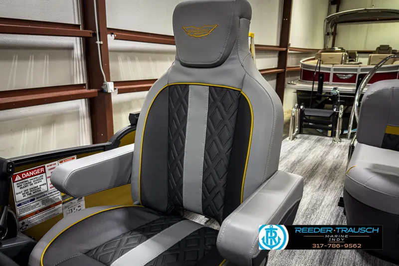 Slide: The Image of 2025 Bennington 22 MSB boat seat with gray and yellow accents in showroom. - 38