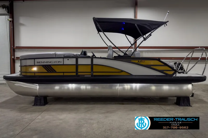 Slide: The Image of 2025 Bennington 22 MSB pontoon boat with canopy in showroom. - 5