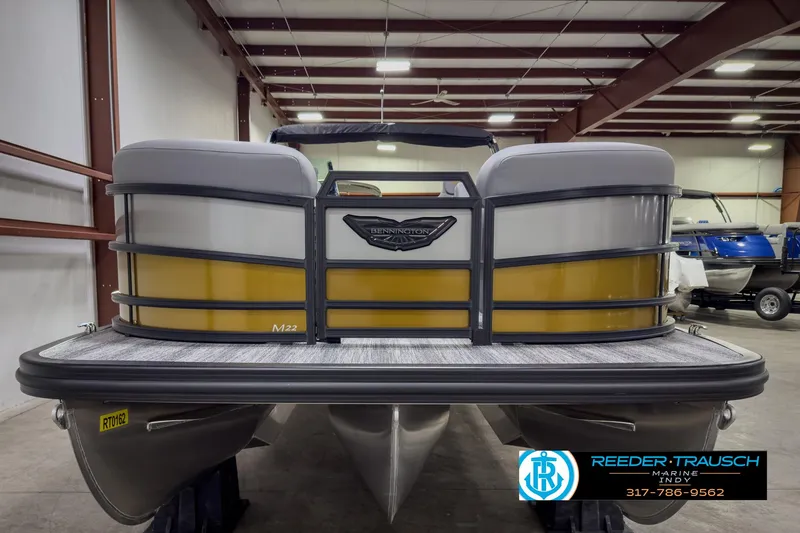 Slide: The Image of 2025 Bennington 22 MSB pontoon boat in showroom, front view. - 8
