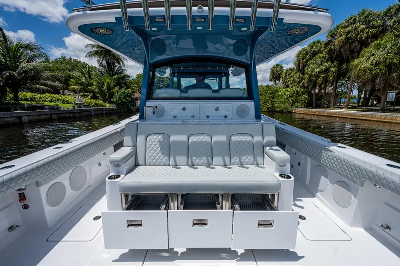 Slide: The Image of 2023 HCB 53 Sueños luxury boat interior with seating and storage drawers. - 10