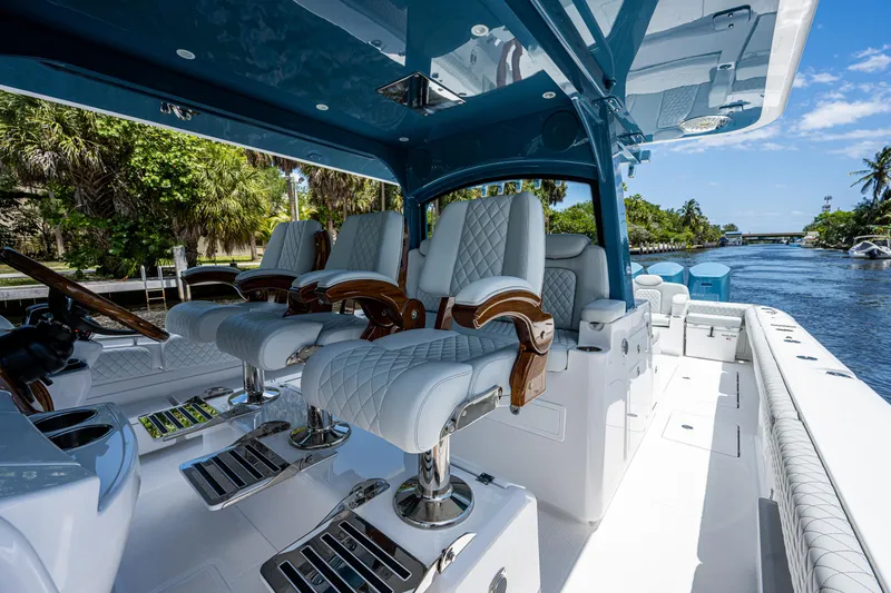 Slide: The Image of Luxurious 2023 HCB 53 Sueños boat interior with plush seating and sleek design. - 14