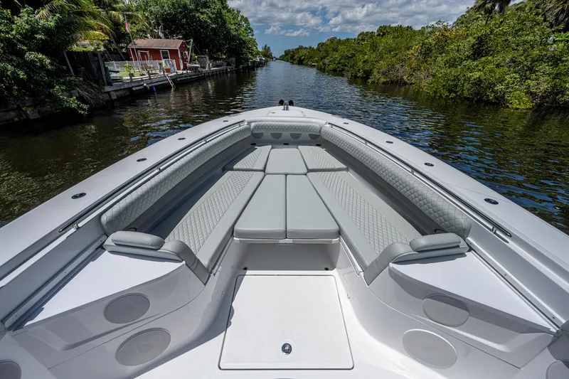 Slide: The Image of 2023 HCB 53 Sueños boat with spacious seating on a scenic waterway. - 23