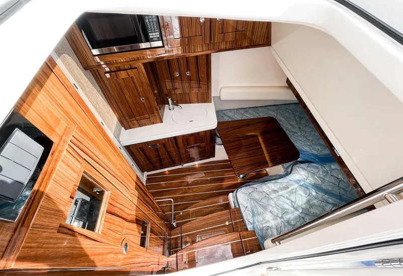 Slide: The Image of Luxurious interior of 2023 HCB 53 Sueños yacht with wood finish and modern amenities. - 29