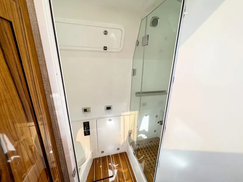 Slide: The Image of Luxurious bathroom interior of 2023 HCB 53 Sueños yacht with wood accents and glass shower. - 33