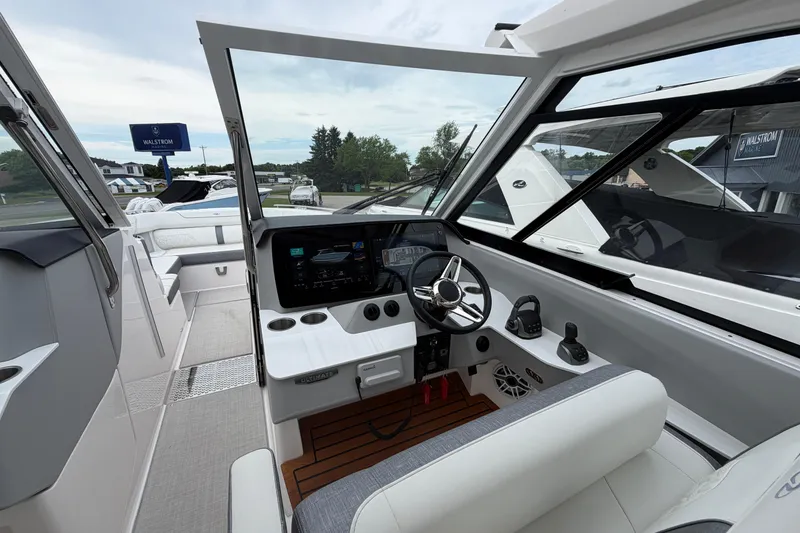 Slide: The Image of 2025 Regal LS36 boat cockpit with modern controls and sleek design. - 11