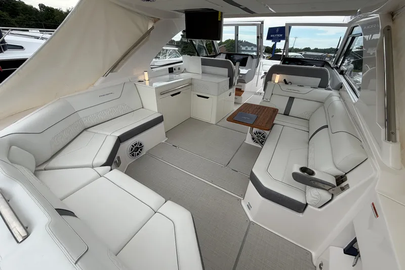 Slide: The Image of Luxurious interior of 2025 Regal LS36 boat with white seating and modern amenities. - 7