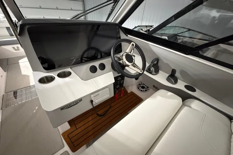 Slide: The Image of 2025 Regal LS36 boat cockpit with modern steering and control panel. - 19