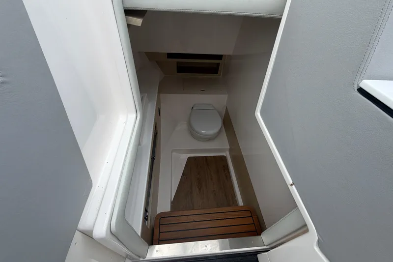 Slide: The Image of Interior view of 2025 Regal LS36 boat bathroom with wooden flooring. - 20