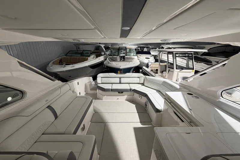 Slide: The Image of Luxurious interior of 2025 Regal LS36 yacht in a showroom with other boats. - 18