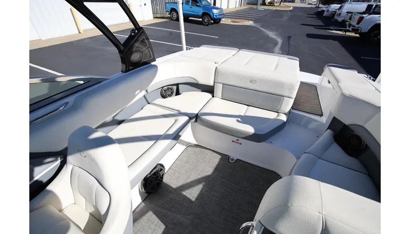 Slide: The Image of 2018 Cobalt 220S boat interior with white seating and carpeted floor. - 10