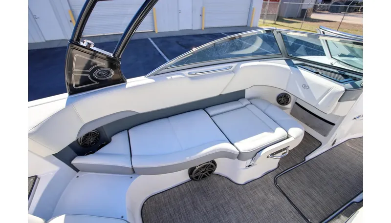 Slide: The Image of 2018 Cobalt 220S boat interior with white seating and modern design. - 13