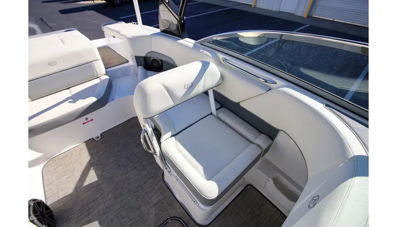 Slide: The Image of 2018 Cobalt 220S boat interior with white seating and carpeted flooring. - 15