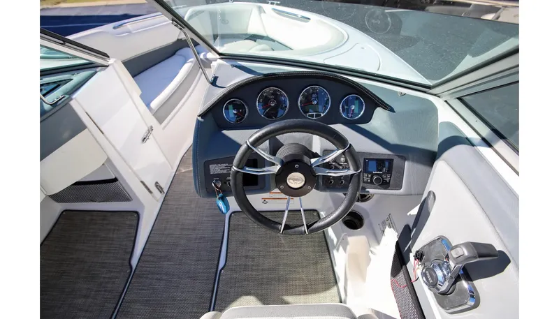 Slide: The Image of 2018 Cobalt 220S boat interior with steering wheel and dashboard controls. - 17