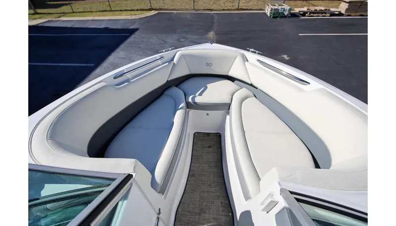 Slide: The Image of 2018 Cobalt 220S boat interior with white cushioned seating. - 18