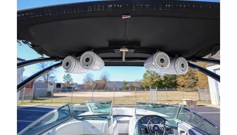 Slide: The Image of 2018 Cobalt 220S boat interior with speakers and steering wheel. - 21