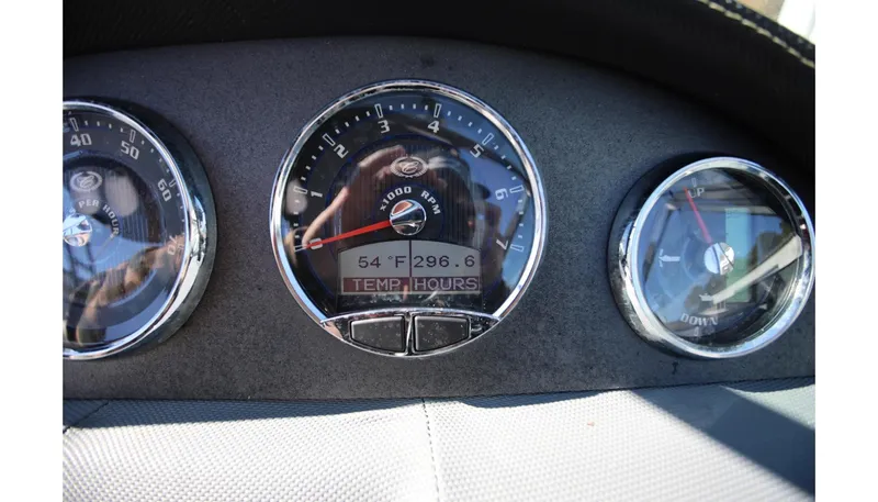 Slide: The Image of Dashboard gauges of a 2018 Cobalt 220S boat, showing temperature and hours. - 22