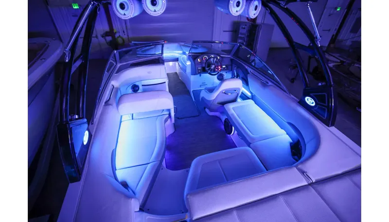 Slide: The Image of 2018 Cobalt 220S boat interior with blue LED lighting and luxurious seating. - 25