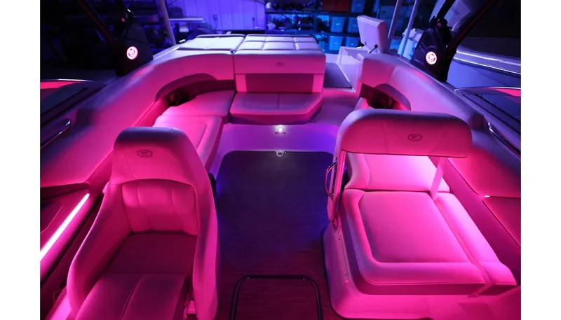 Slide: The Image of 2018 Cobalt 220S boat interior with vibrant pink LED lighting. - 29