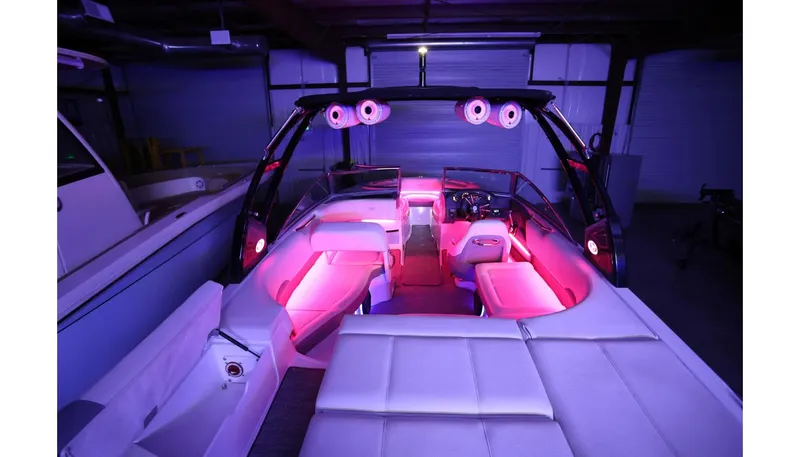 Slide: The Image of 2018 Cobalt 220S boat interior with vibrant pink LED lighting. - 32