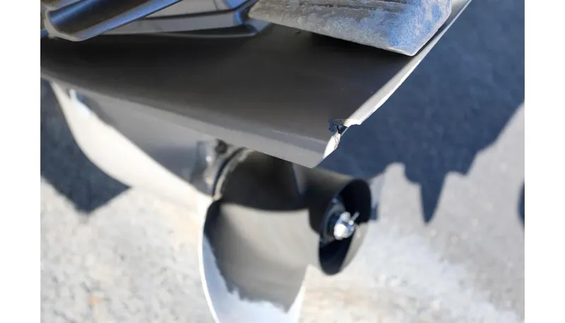 Slide: The Image of Close-up of a 2018 Cobalt 220S boat propeller with visible damage. - 6