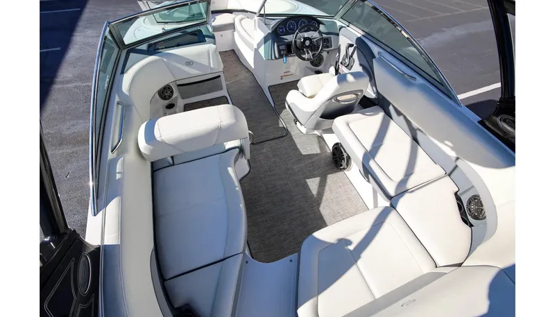 Slide: The Image of 2018 Cobalt 220S boat interior with white seating and modern dashboard. - 9