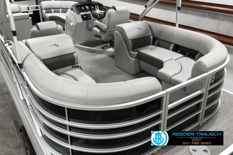 Slide: The Image of 2022 Bennington 23 LSR pontoon boat interior with plush seating and modern helm. - 12