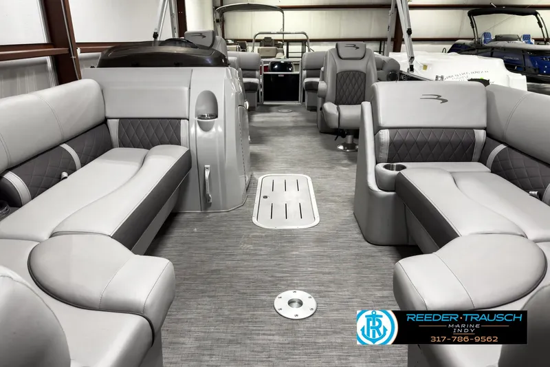 Slide: The Image of 2022 Bennington 23 LSR pontoon boat interior with gray seating and modern design. - 13