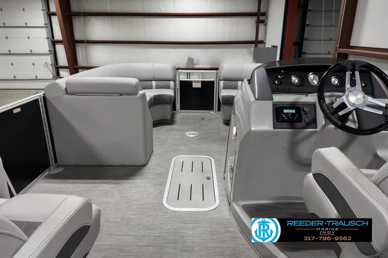 Slide: The Image of 2022 Bennington 23 LSR pontoon boat interior with modern seating and steering console. - 17