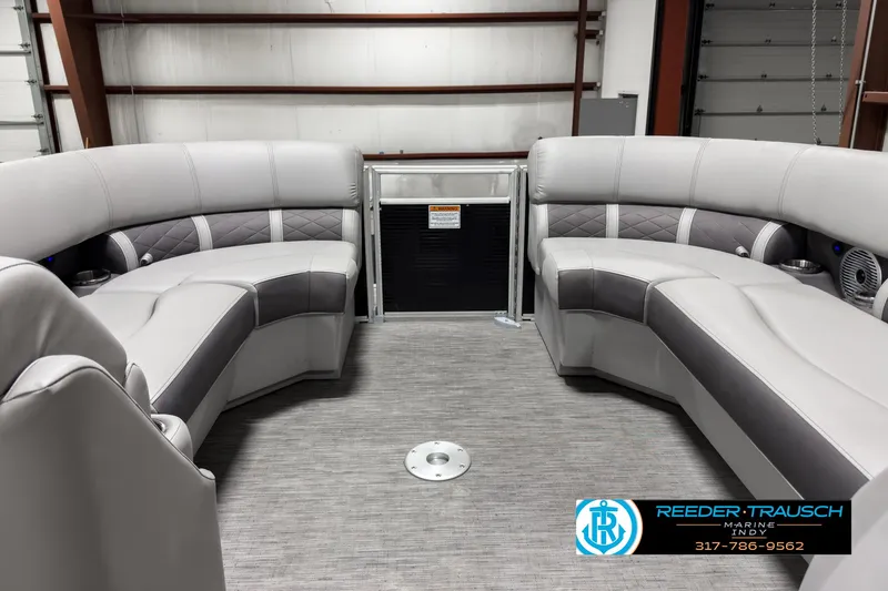 Slide: The Image of 2022 Bennington 23 LSR boat interior with gray seating and carpeted floor. - 18