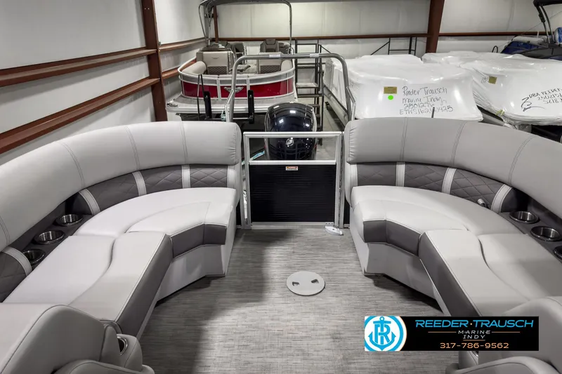 Slide: The Image of 2022 Bennington 23 LSR pontoon boat interior with gray seating in showroom. - 22