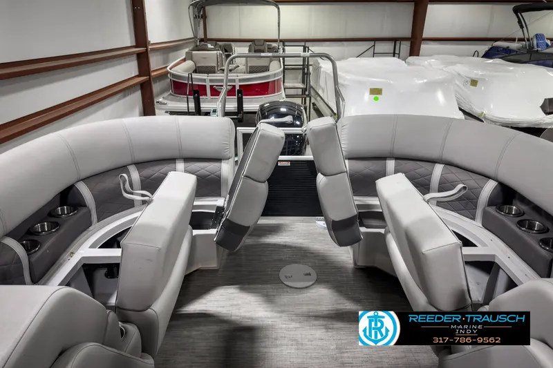 Slide: The Image of 2022 Bennington 23 LSR pontoon boat interior with gray seating and modern design. - 23