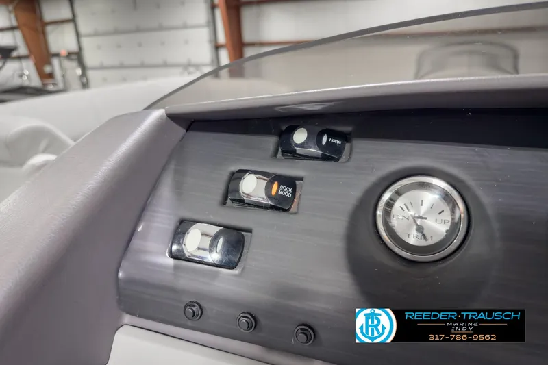 Slide: The Image of Dashboard of 2022 Bennington 23 LSR boat with controls and clock. - 28