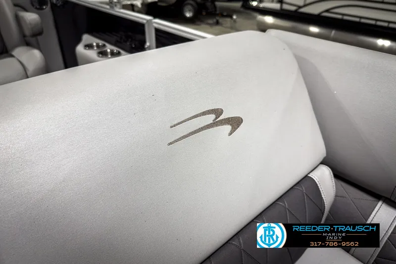 Slide: The Image of 2022 Bennington 23 LSR boat interior with logo and Reeder-Trausch branding. - 37
