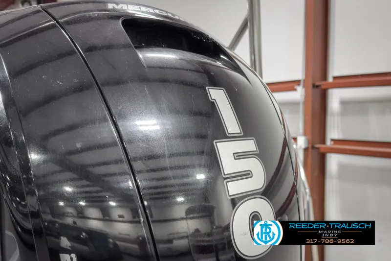 Slide: The Image of Close-up of a Mercury 150 outboard motor on a 2022 Bennington 23 LSR boat. - 42