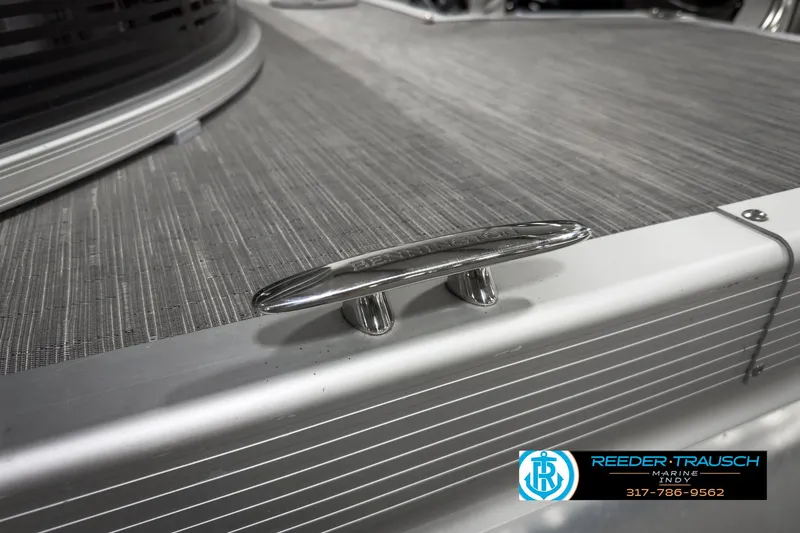 Slide: The Image of 2022 Bennington 23 LSR boat deck with cleat, Reeder-Trausch Marine logo visible. - 47