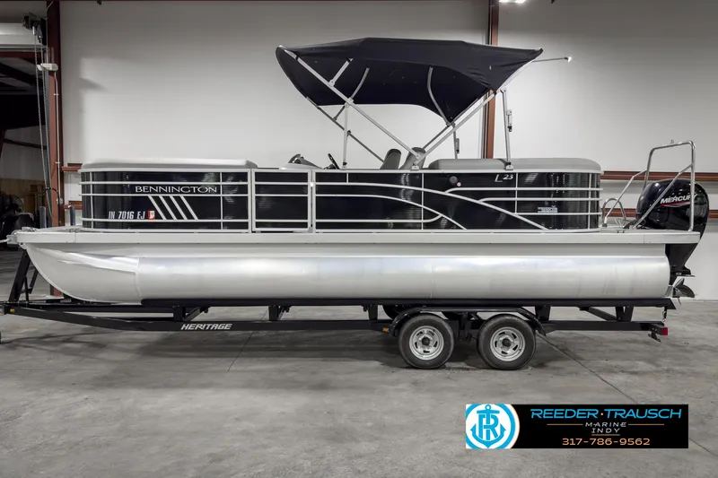 Slide: The Image of 2022 Bennington 23 LSR pontoon boat on trailer in indoor showroom. - 5