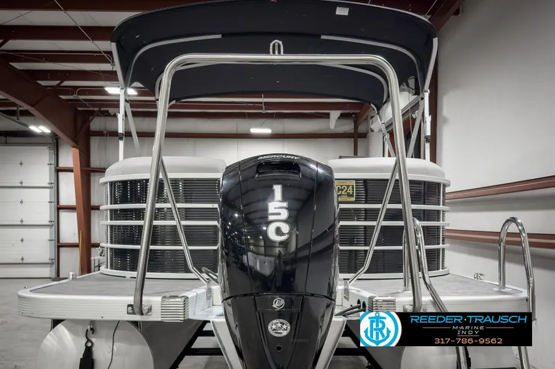Slide: The Image of 2022 Bennington 23 LSR pontoon boat with 150 HP engine in showroom. - 7