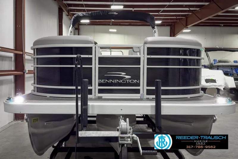Slide: The Image of 2022 Bennington 23 LSR pontoon boat in showroom, front view. - 8