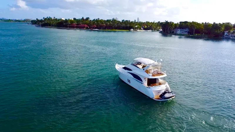 Slide: The Image of Luxury 2007 Marquis 59 Markham Edition yacht cruising on serene waters. - 1