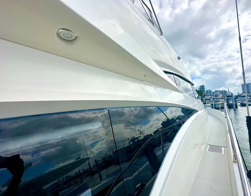 Slide: The Image of Side view of 2007 Marquis 59 Markham Edition yacht with marina reflection. - 13