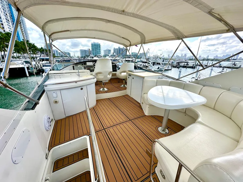 Slide: The Image of Luxurious 2007 Marquis 59 Markham Edition yacht with spacious deck and seating area. - 16